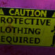 Caution-Protective Clothing Required